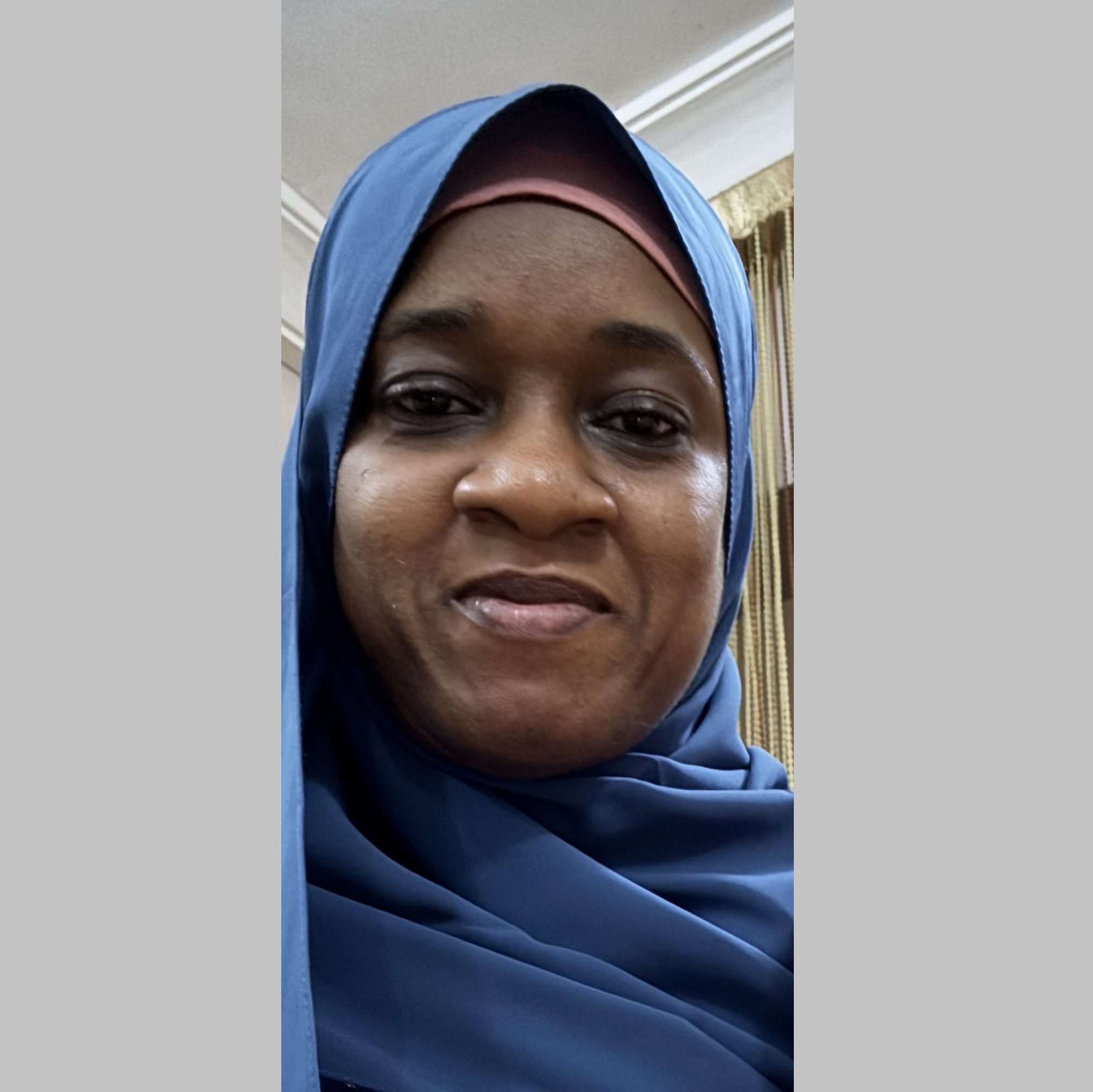 Head and shoulders image of a woman in a headscarf